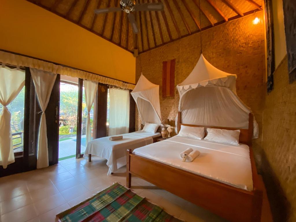 Letto o letti in una camera di Sejuk Cottages