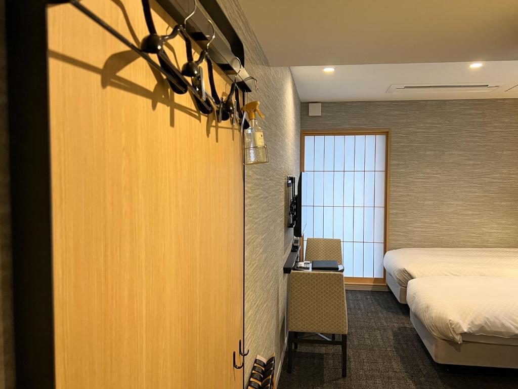 Rinn Kyoto Station客房内的一张或多张床位