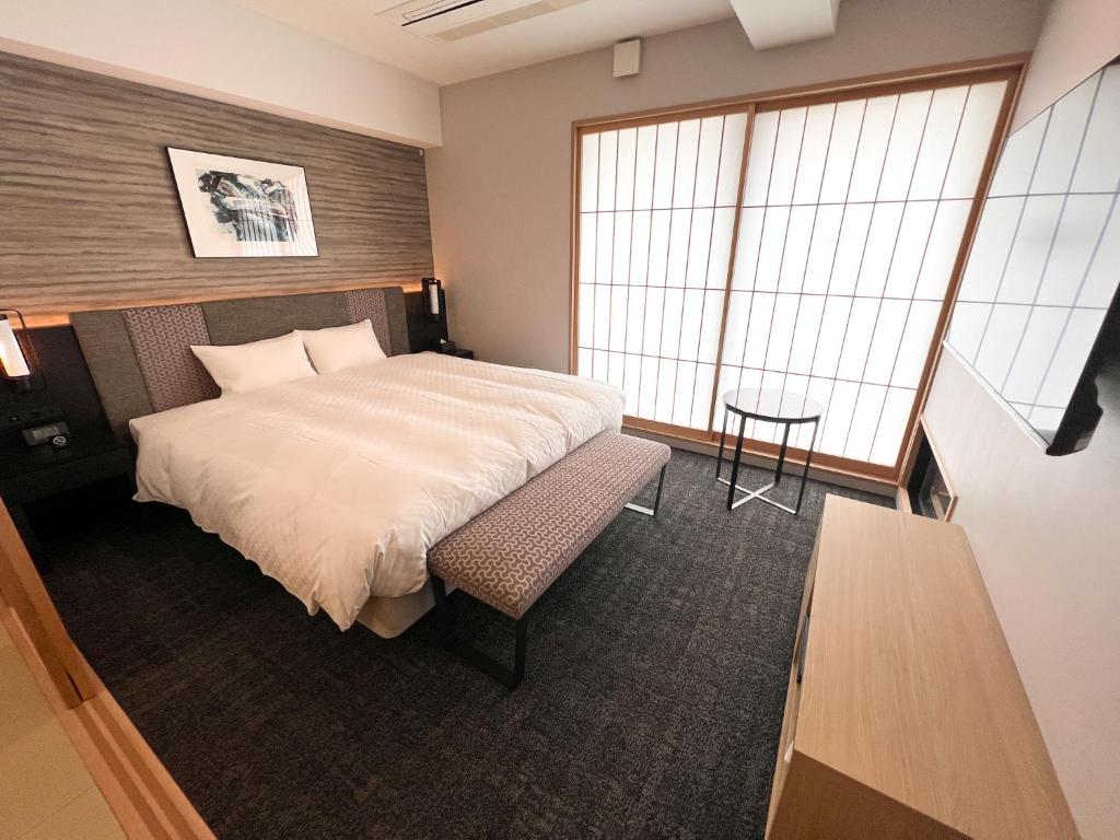Rinn Kyoto Station客房内的一张或多张床位
