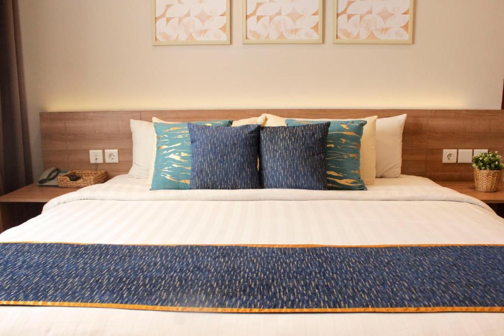Postel nebo postele na pokoji v ubytování Antero Hotel Jababeka
