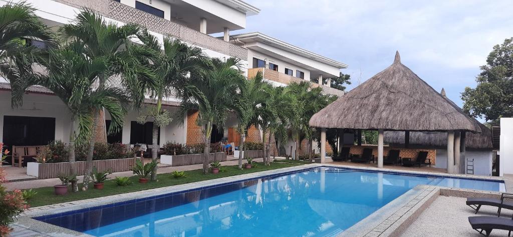 a resort with a swimming pool and a gazebo at Panglao Bamboo Oasis in Panglao