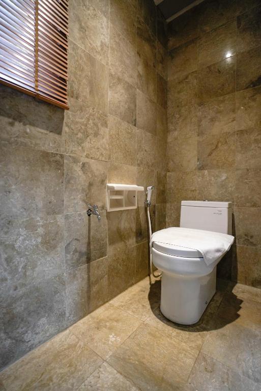 Koupelna v ubytování Umah Lawas Villa Ubud