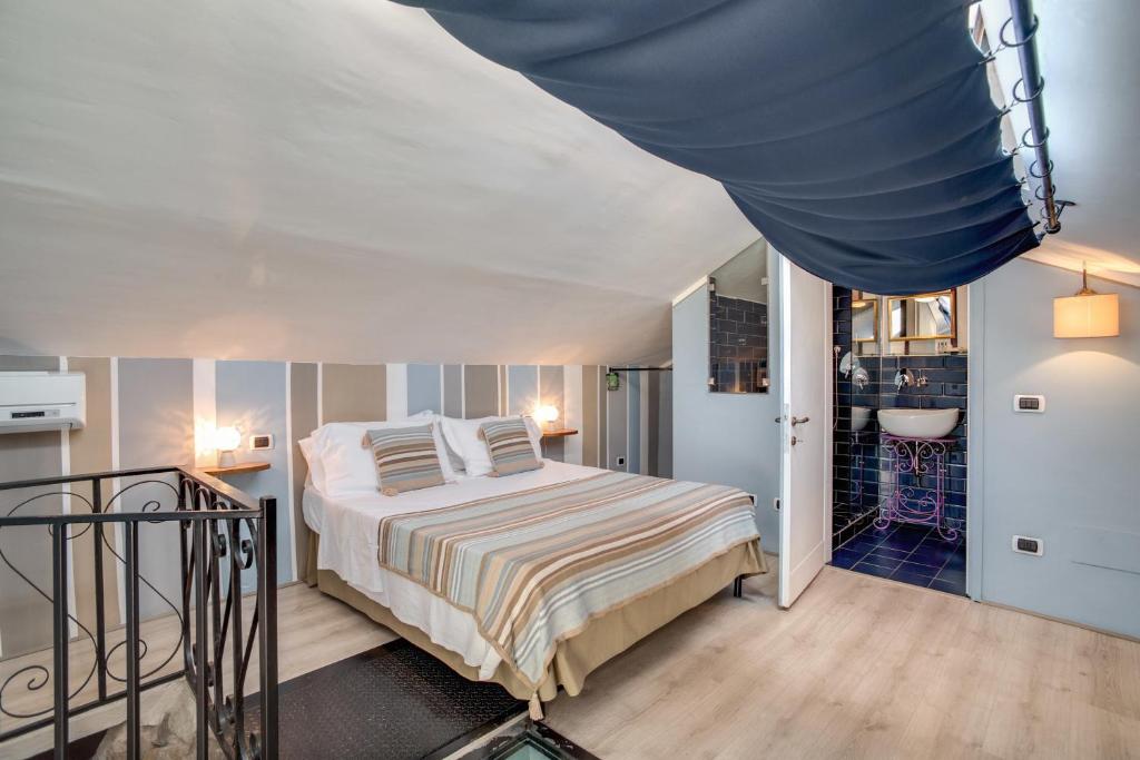 Postel nebo postele na pokoji v ubytování Hotel Borgo Vistalago