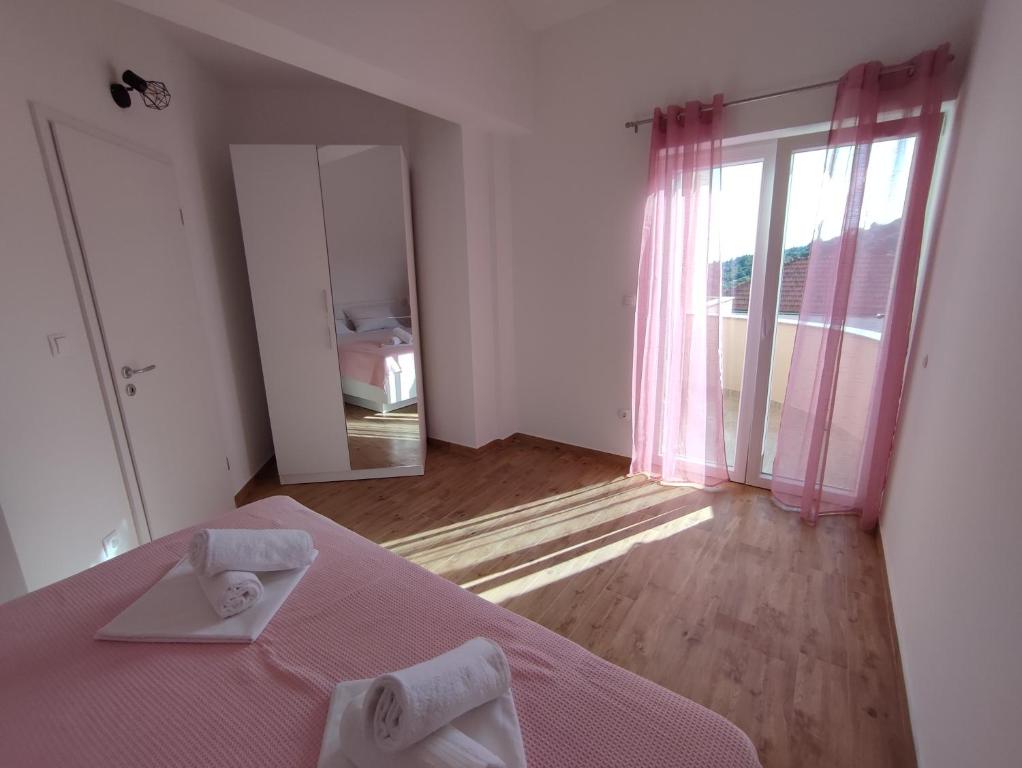 Posteľ alebo postele v izbe v ubytovaní Apartmani V&V - new apartments