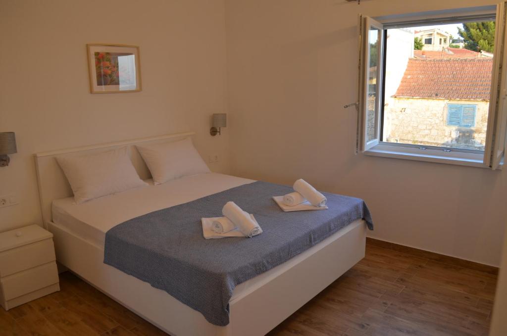 Posteľ alebo postele v izbe v ubytovaní Apartmani V&V - new apartments
