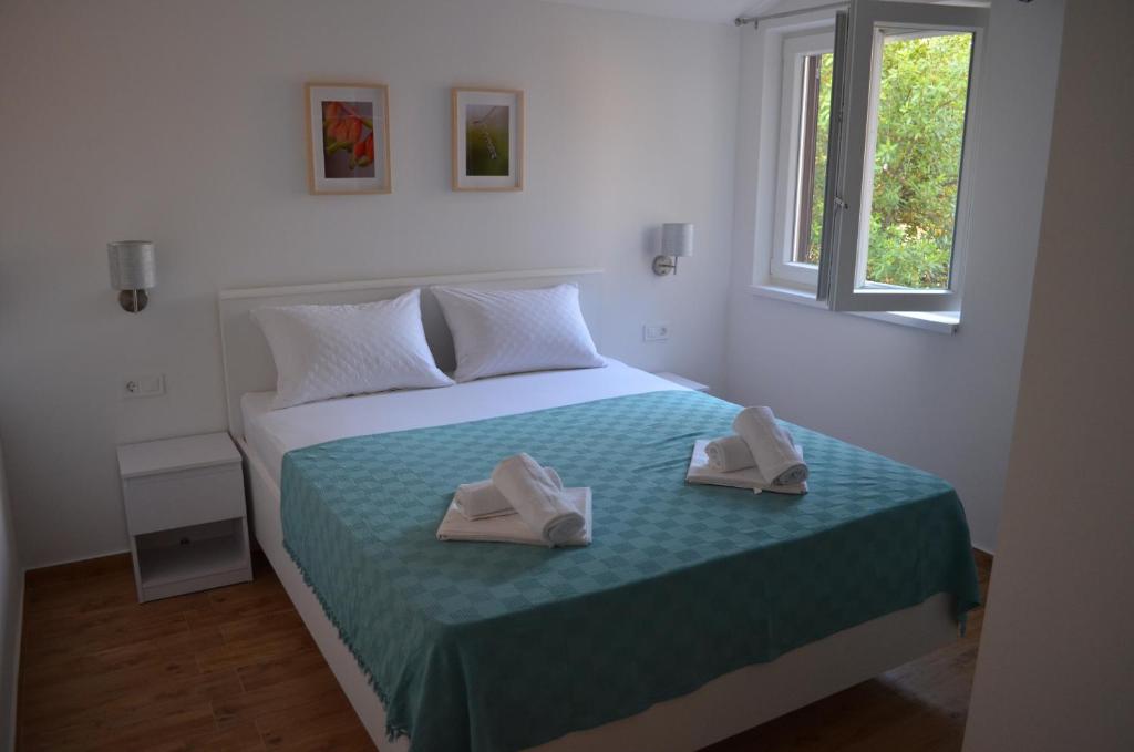 Posteľ alebo postele v izbe v ubytovaní Apartmani V&V - new apartments