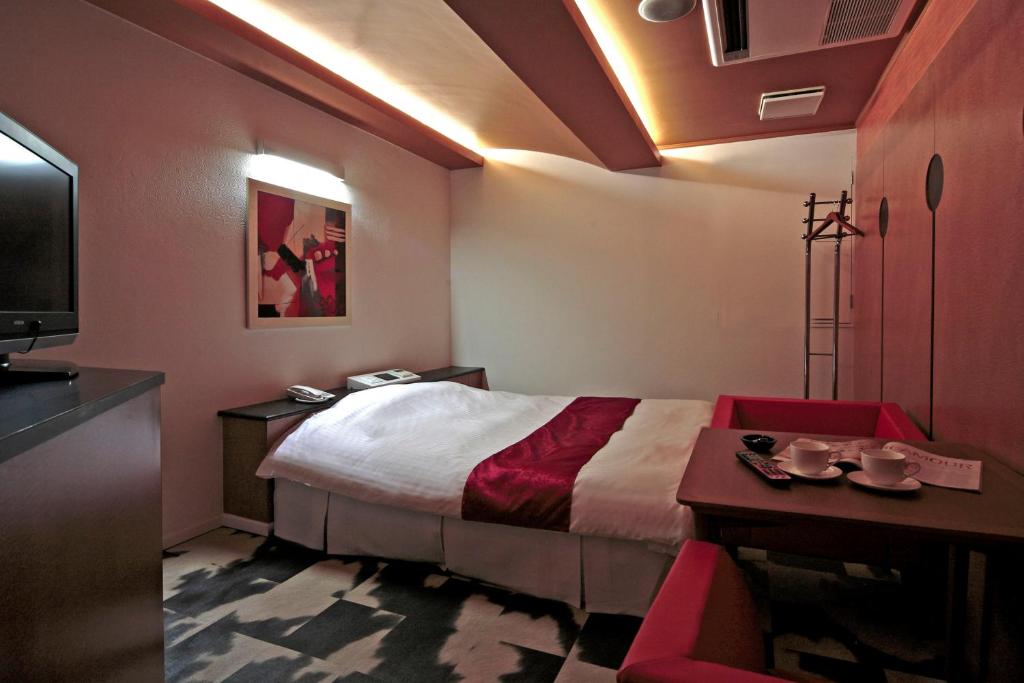 Postel nebo postele na pokoji v ubytování Hotel LALA minato - Adult Only