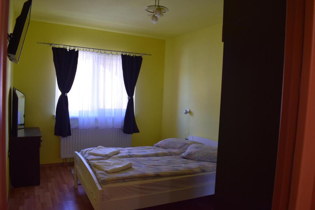 Postel nebo postele na pokoji v ubytování Gamma