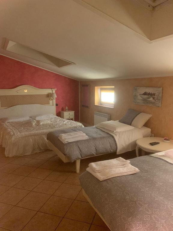 Postel nebo postele na pokoji v ubytování Hotel Due Colonne