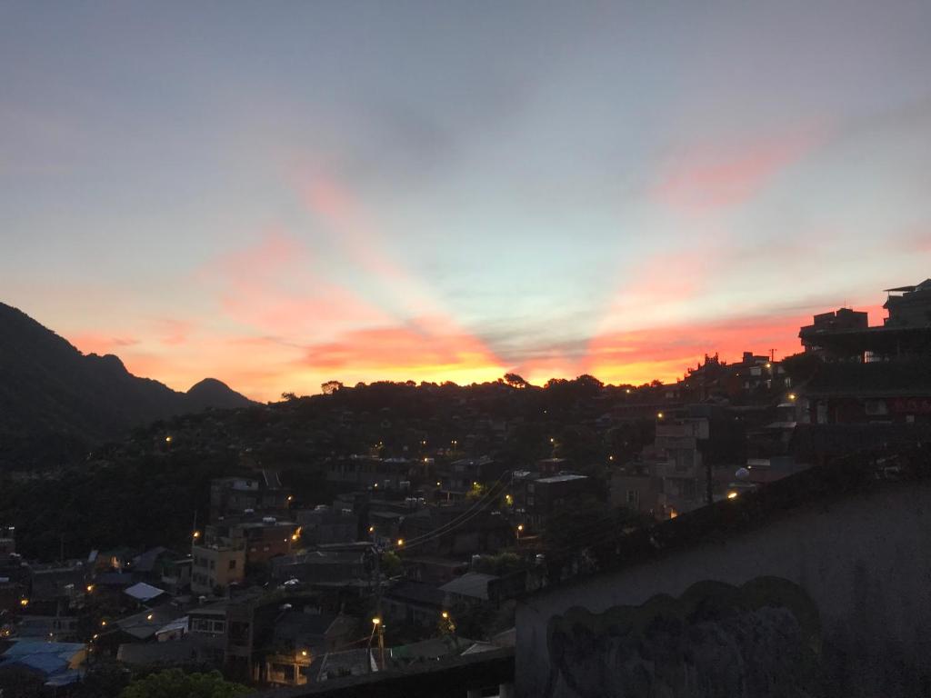 a view of a city at sunset at A-HOME in Jiufen