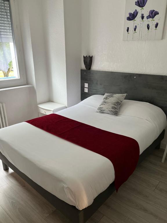 Postel nebo postele na pokoji v ubytování Hôtel Agena