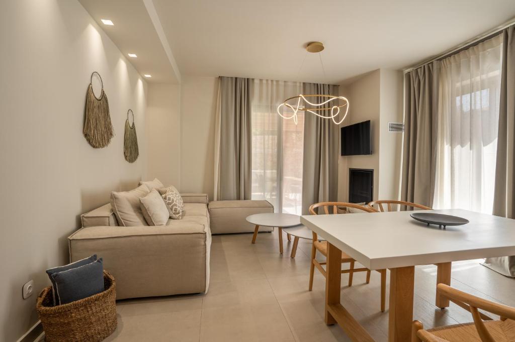 Telewizja i/lub zestaw kina domowego w obiekcie PAPADRIA VILLAS - Modern Luxury villas near Kathisma Beach