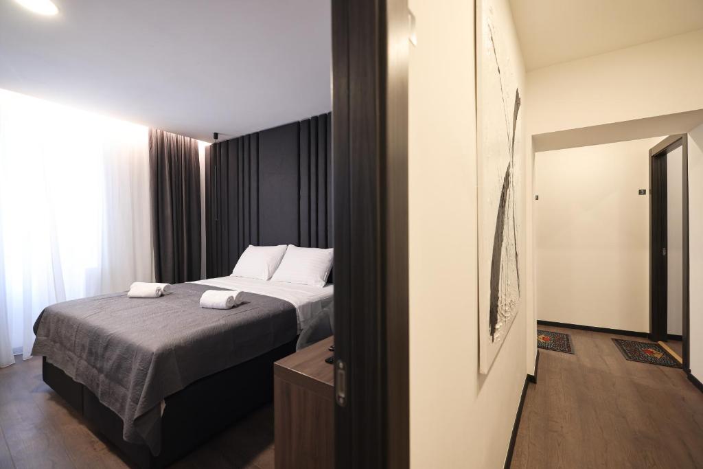 Łóżko lub łóżka w pokoju w obiekcie City Premium Rooms Old town