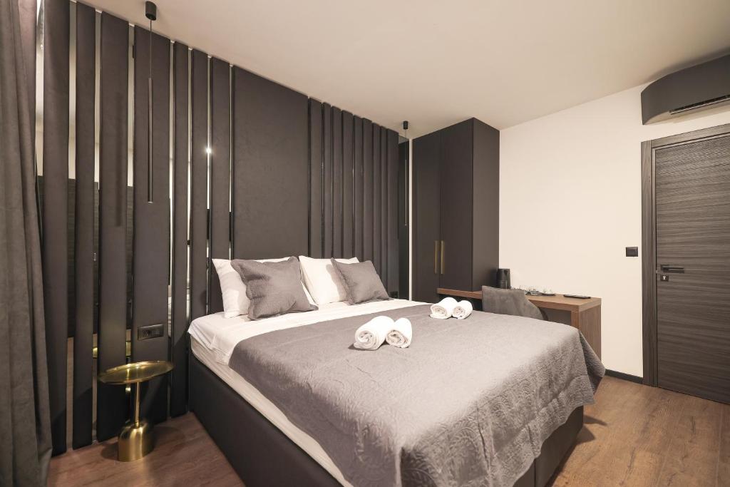 Łóżko lub łóżka w pokoju w obiekcie City Premium Rooms Old town