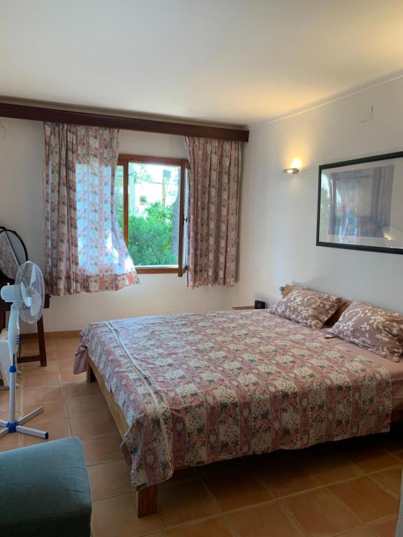 Postel nebo postele na pokoji v ubytování Gemütliches Ferienhaus am Club Nautico, Santa Ponça