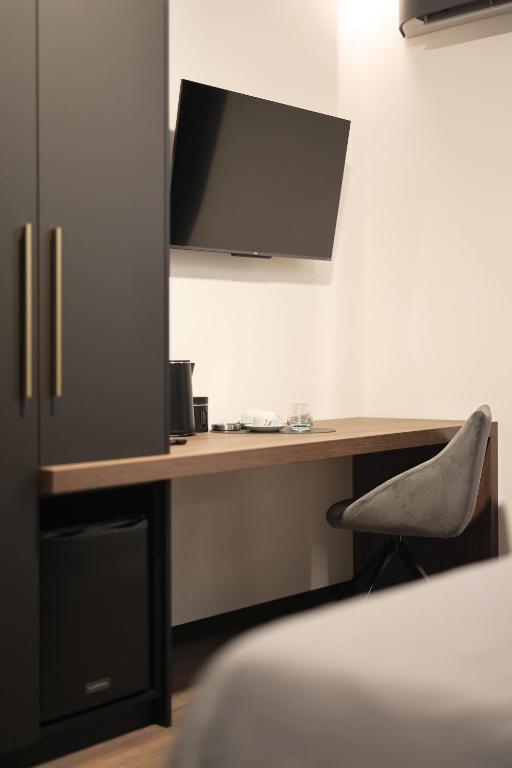 Telewizja i/lub zestaw kina domowego w obiekcie City Premium Rooms Old town