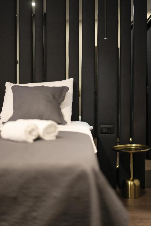 Łóżko lub łóżka w pokoju w obiekcie City Premium Rooms Old town