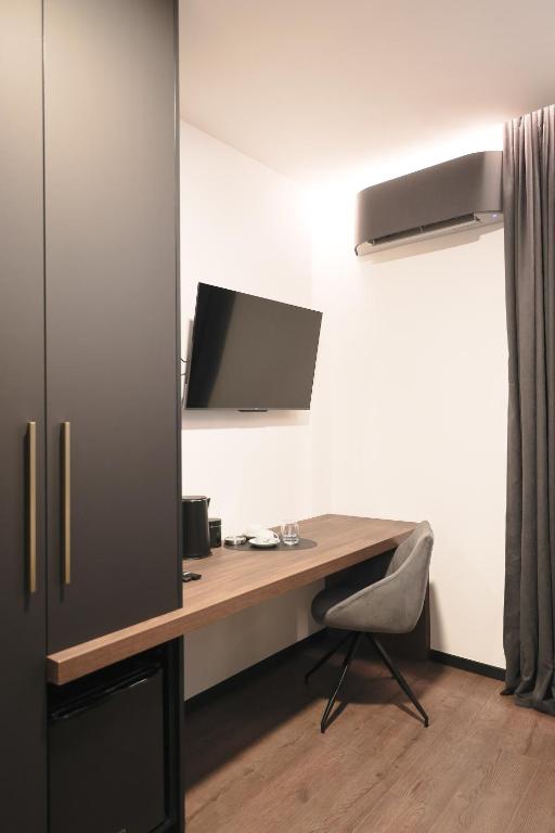 Telewizja i/lub zestaw kina domowego w obiekcie City Premium Rooms Old town