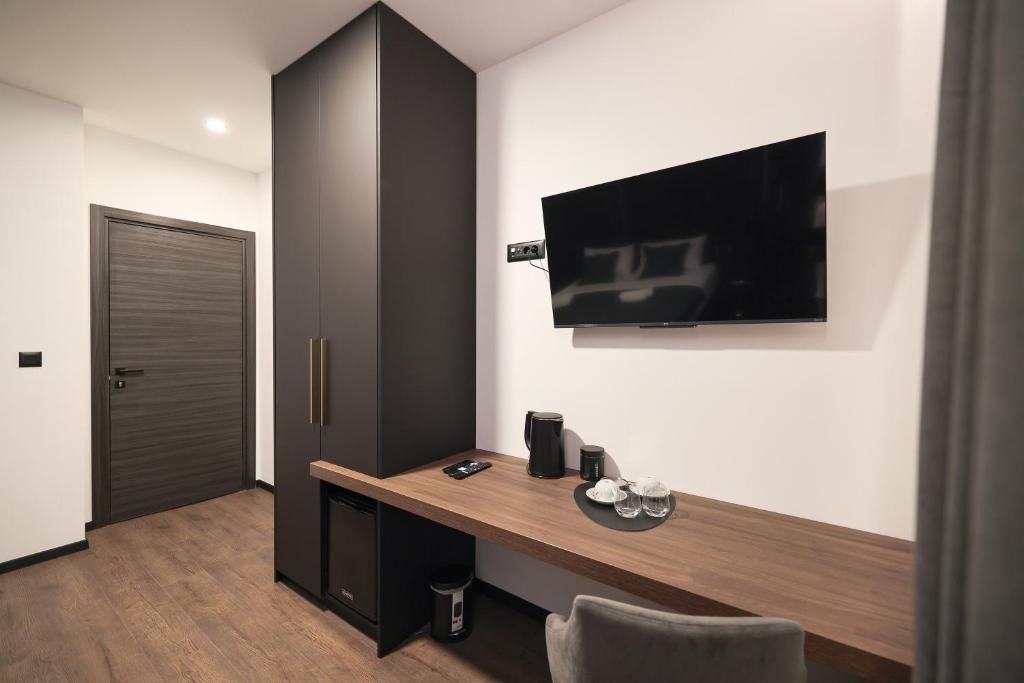 Telewizja i/lub zestaw kina domowego w obiekcie City Premium Rooms Old town