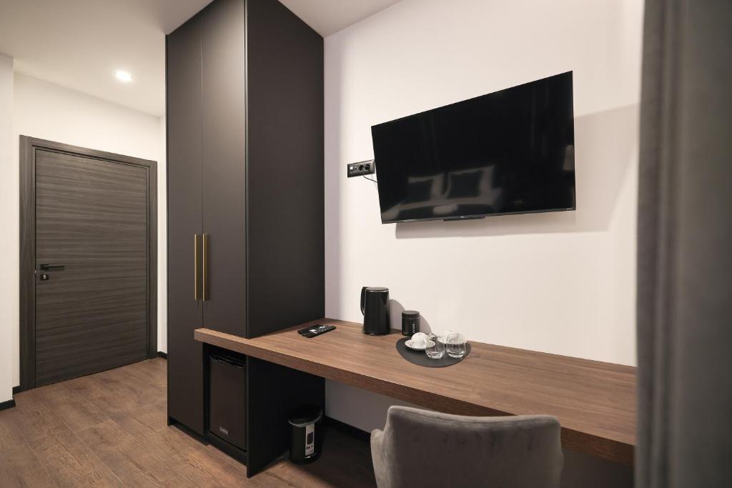 Telewizja i/lub zestaw kina domowego w obiekcie City Premium Rooms Old town