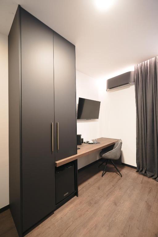 Telewizja i/lub zestaw kina domowego w obiekcie City Premium Rooms Old town