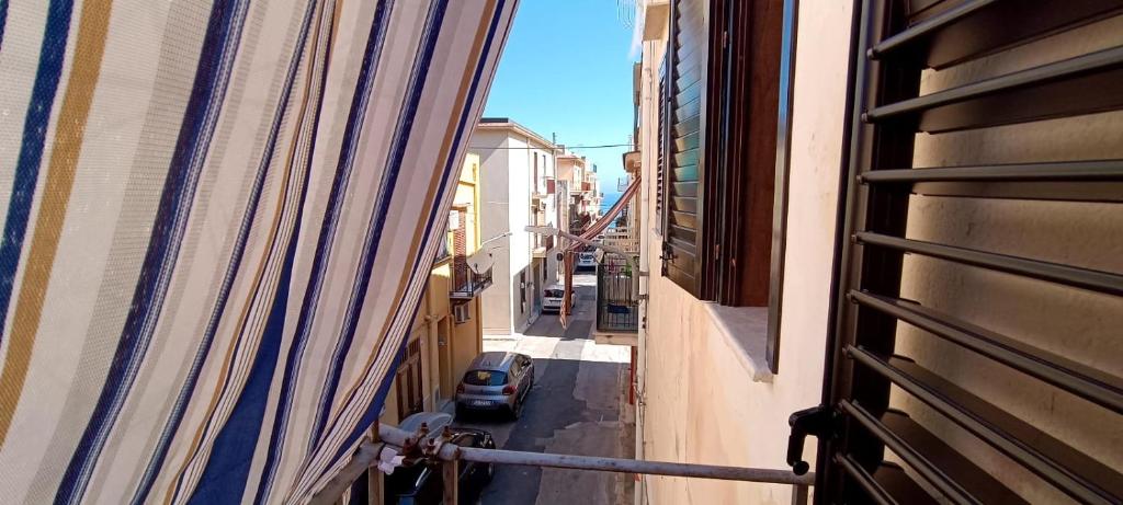 a view of a street from a window of a building at La Rosa Dei Venti in Castellammare del Golfo