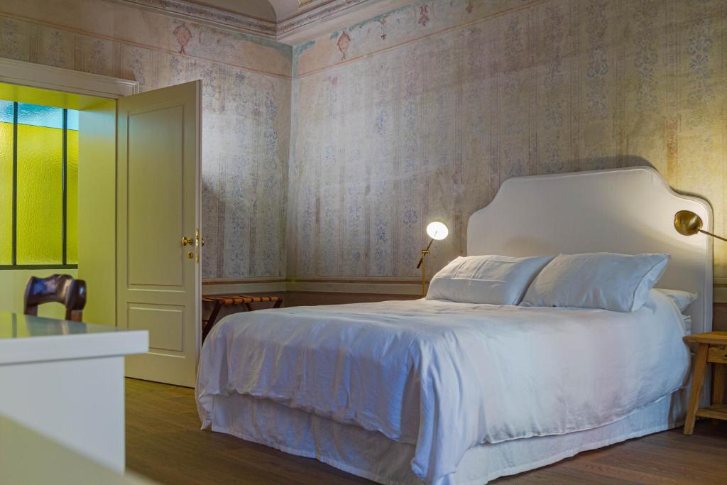 Posteľ alebo postele v izbe v ubytovaní Palazzo Glori 6