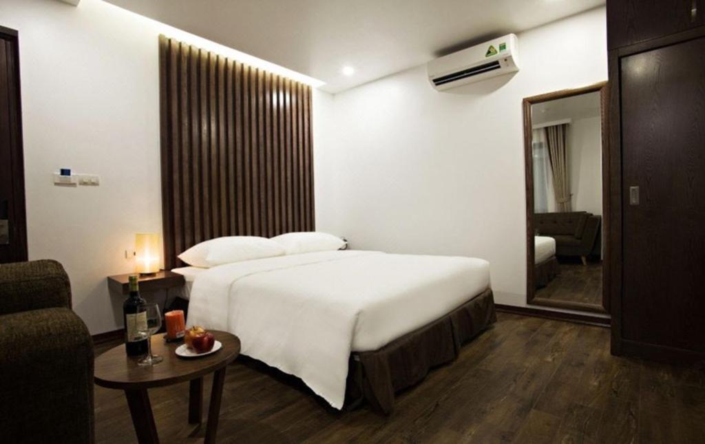 Postel nebo postele na pokoji v ubytování Inearth Hotel