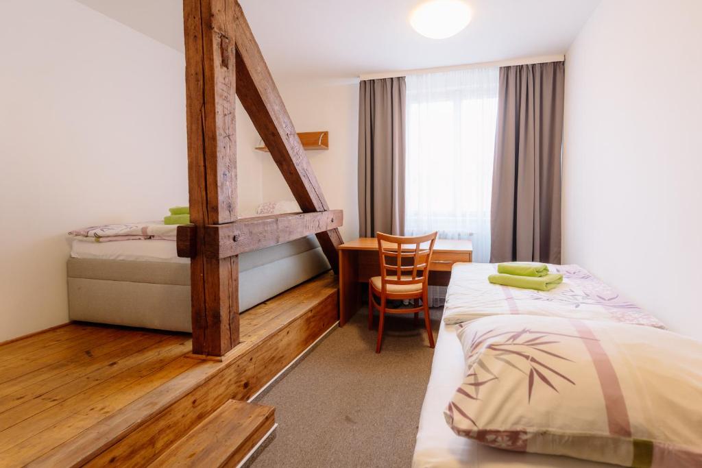 Postel nebo postele na pokoji v ubytování Hotel Marianeum
