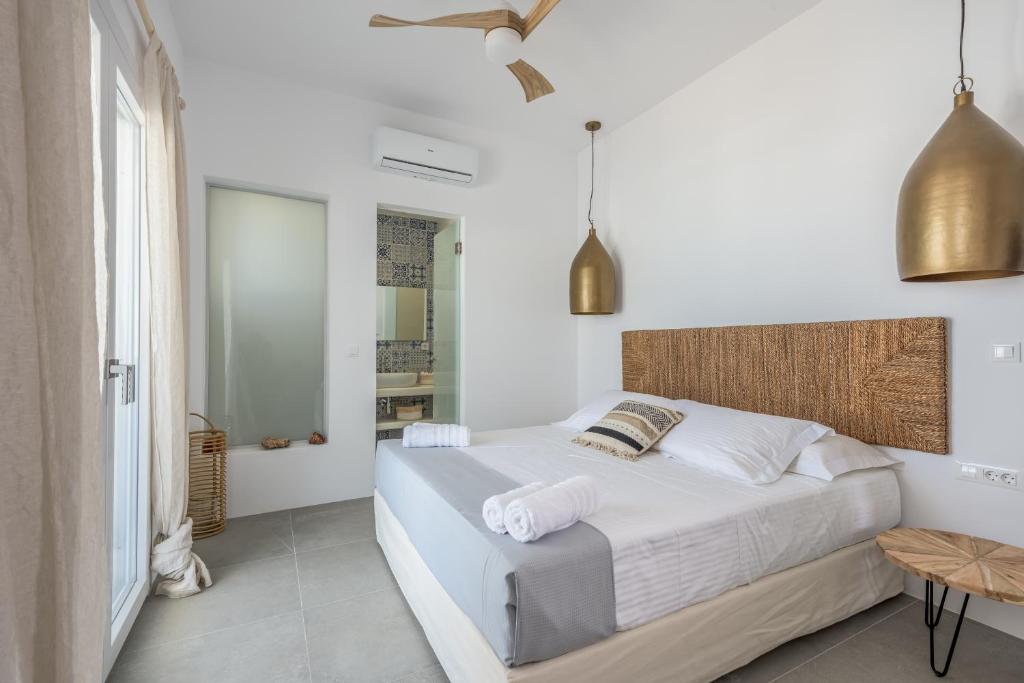 Posteľ alebo postele v izbe v ubytovaní Elyos Apartments