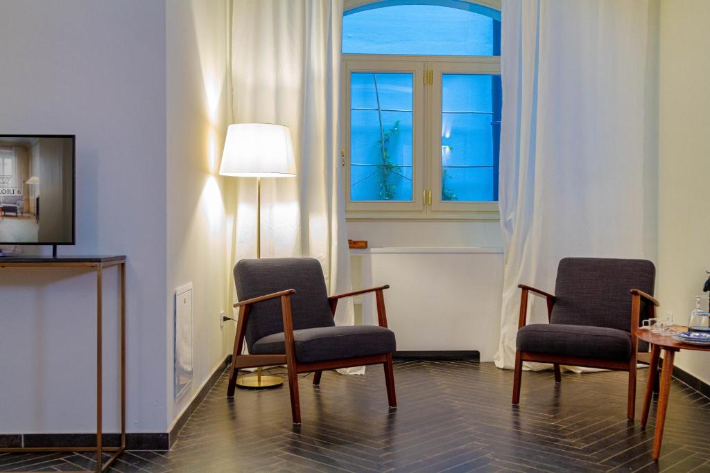 Televízia a/alebo spoločenská miestnosť v ubytovaní Palazzo Glori 6