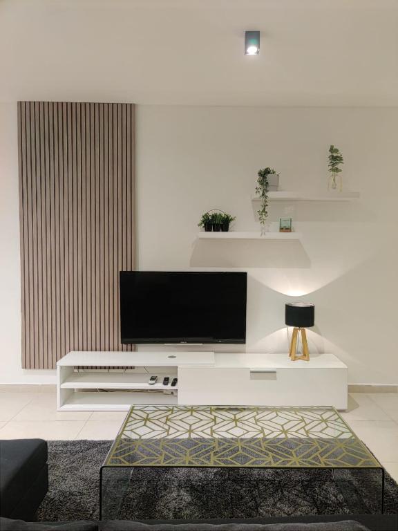 Televisor o centre d'entreteniment de Qawra Apartment