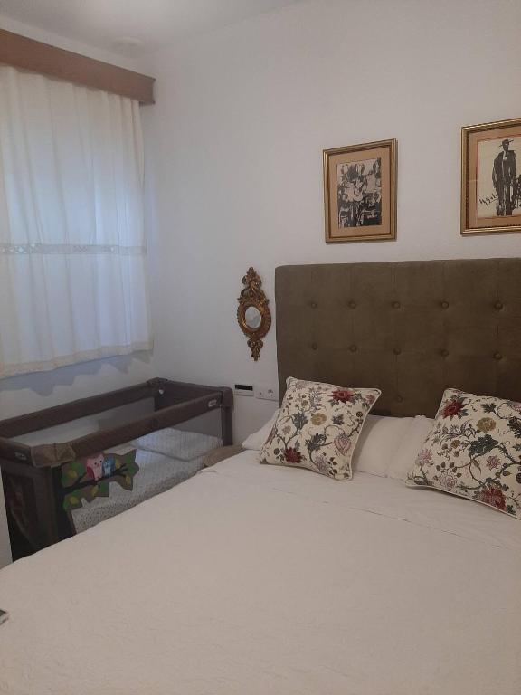 Postel nebo postele na pokoji v ubytování Barrio Santa Cruz VUT-SE-00227