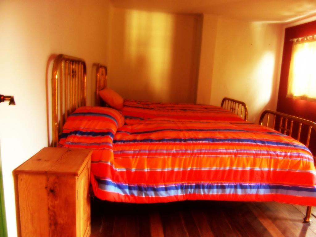 Postel nebo postele na pokoji v ubytování Anata Hostal