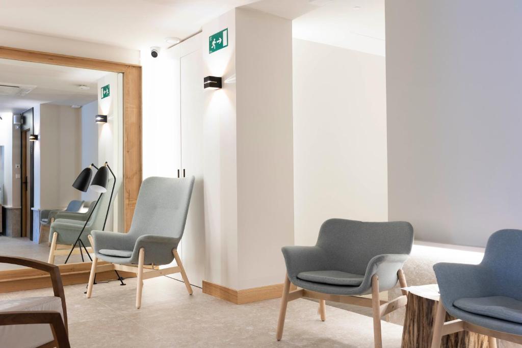 Area soggiorno di URBAIA ROOMS