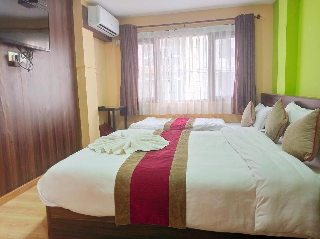 Postel nebo postele na pokoji v ubytování Holiday Hostel