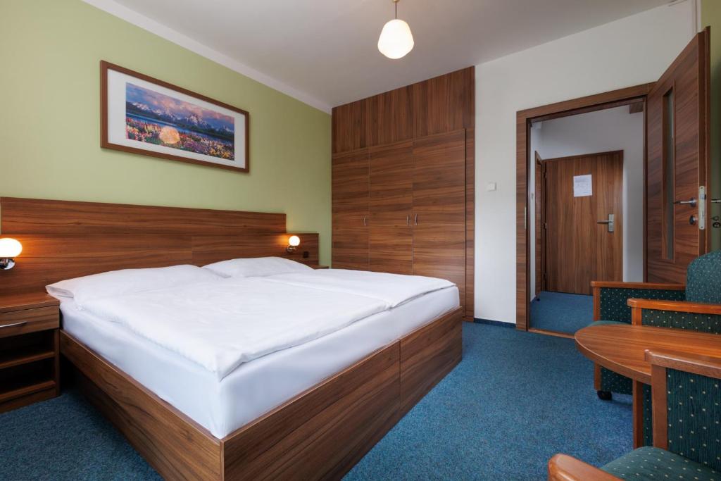 Postel nebo postele na pokoji v ubytování Resort Dlouhé Stráně