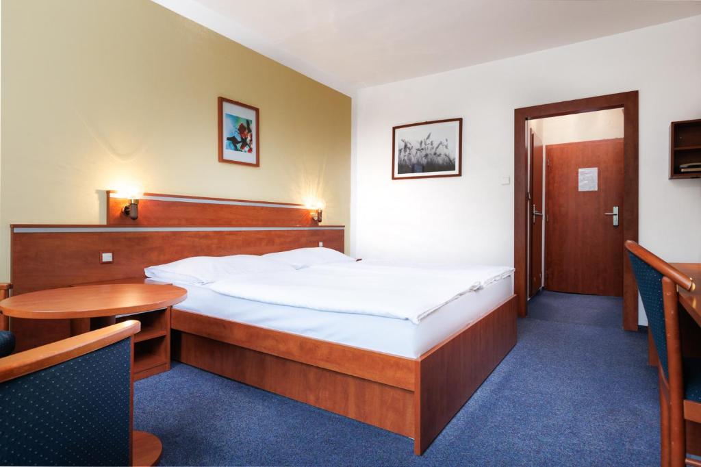 Postel nebo postele na pokoji v ubytování Resort Dlouhé Stráně