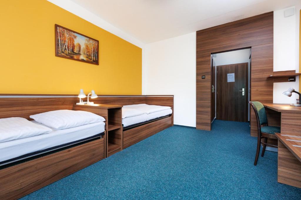 Postel nebo postele na pokoji v ubytování Resort Dlouhé Stráně