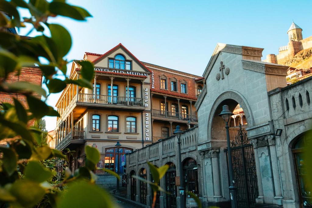 a group of buildings on a city street at Old Meidan Tbilisi By Urban Hotels in Tbilisi City