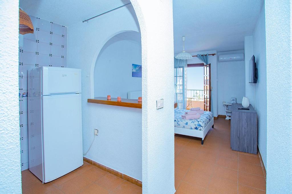 A bed or beds in a room at 042 Peaceful Mar View - Alicante Holiday