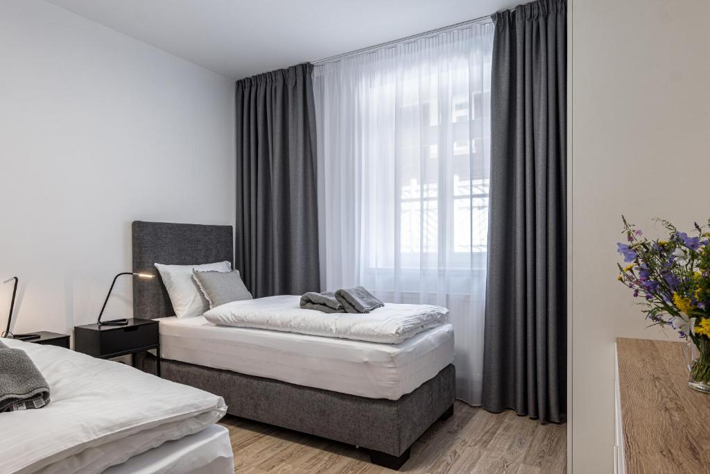 Postel nebo postele na pokoji v ubytování Hubertus Karlova Studánka