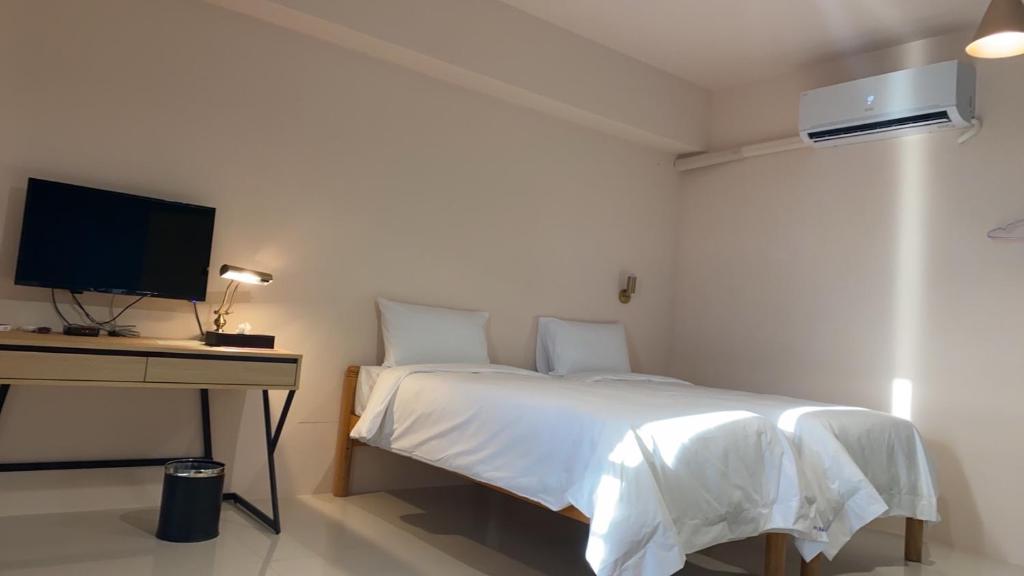 Postel nebo postele na pokoji v ubytování Shui Shang Yuan Homestay