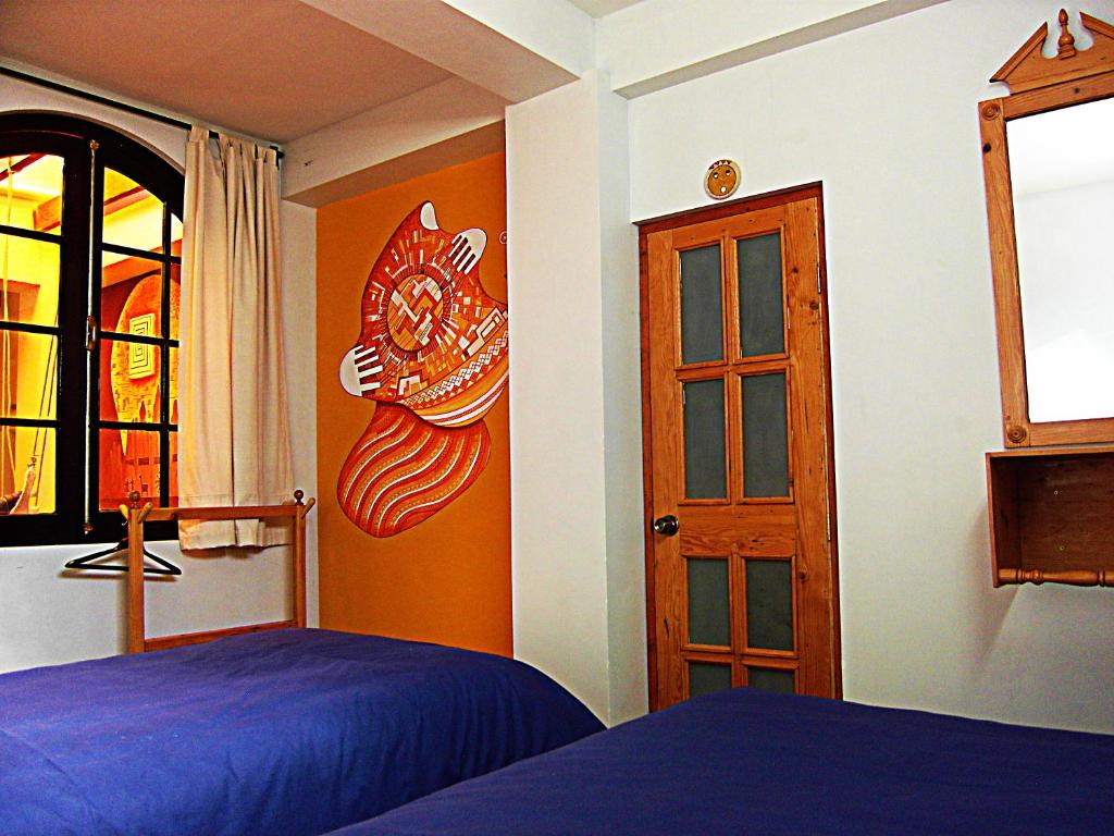 Postel nebo postele na pokoji v ubytování Anata Hostal