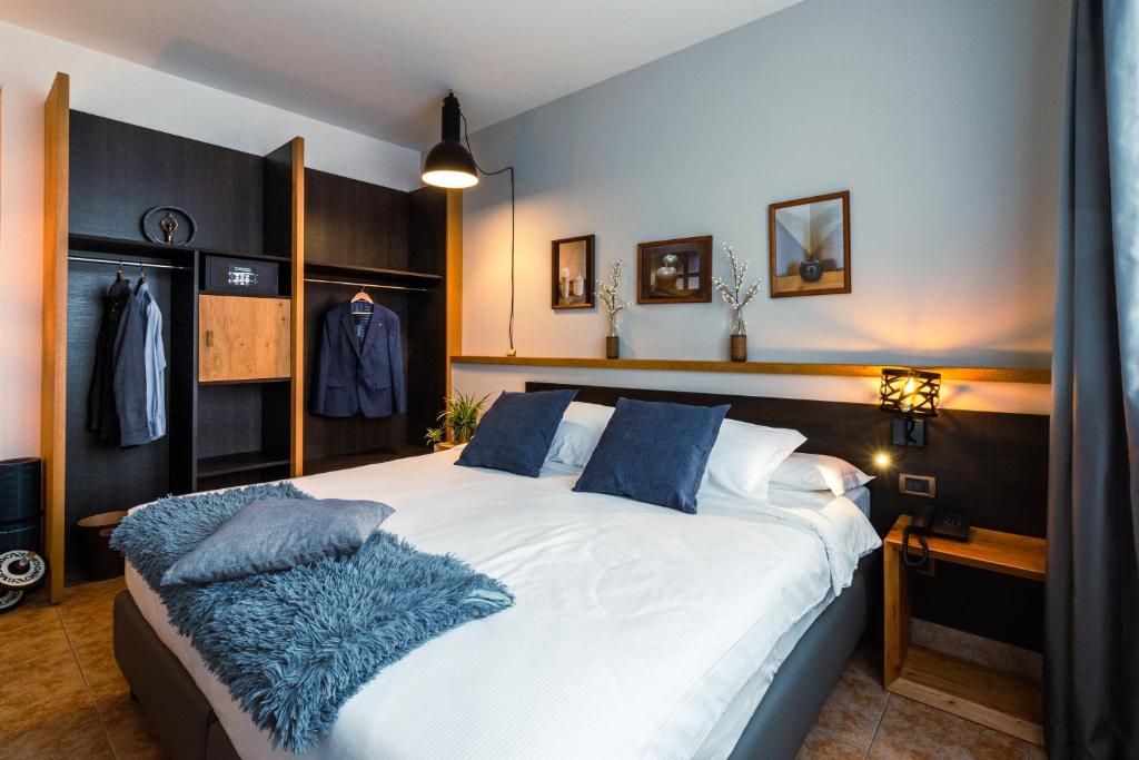 Postel nebo postele na pokoji v ubytování Ancora Sport Resort Hotel