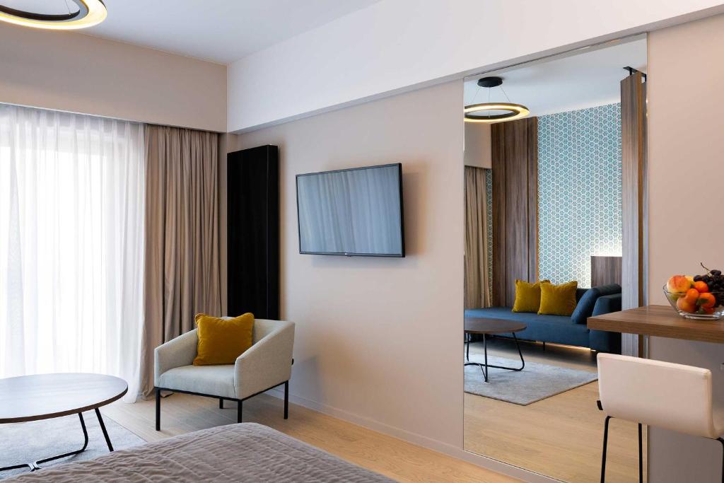 TV a/nebo společenská místnost v ubytování The Central Kirchberg - Smart ApartHotel