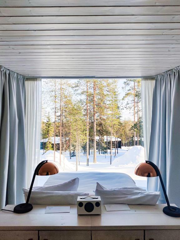 Postel nebo postele na pokoji v ubytování Arctic TreeHouse Hotel