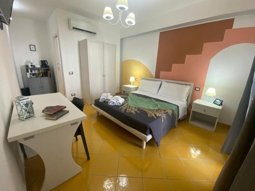 Voodi või voodid majutusasutuse Postino Rooms toas