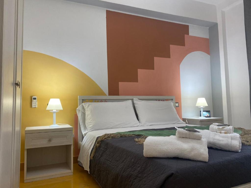 Voodi või voodid majutusasutuse Postino Rooms toas