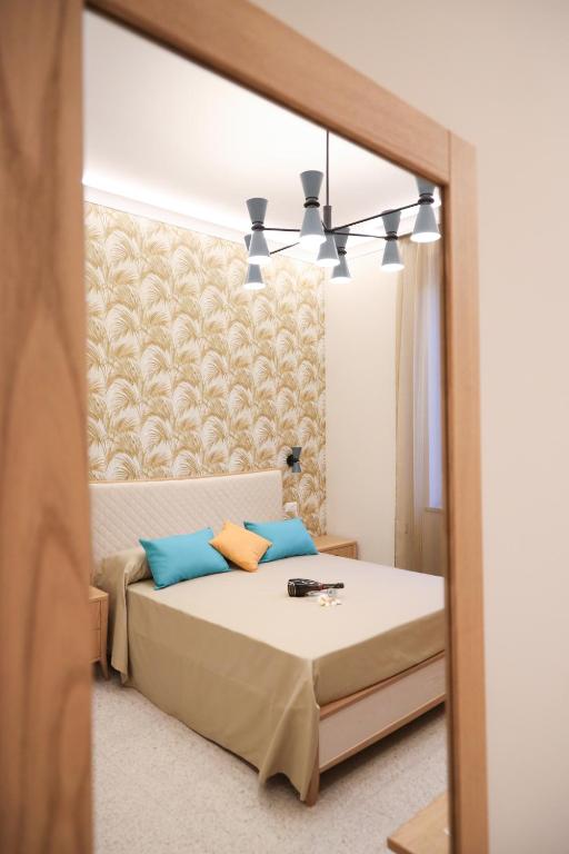 A bed or beds in a room at Don Francisco Rooms - TROPEA